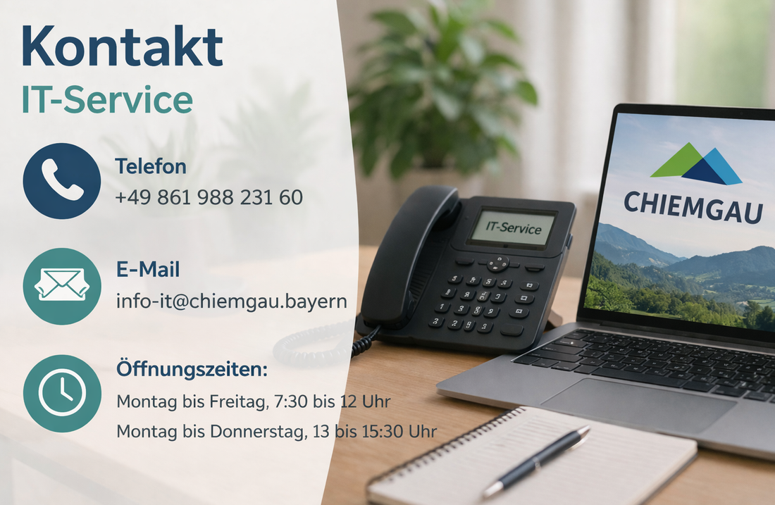 Arbeitsplatz mit Telefon, Laptop und Notizbuch zur Darstellung des IT-Service-Kontakts